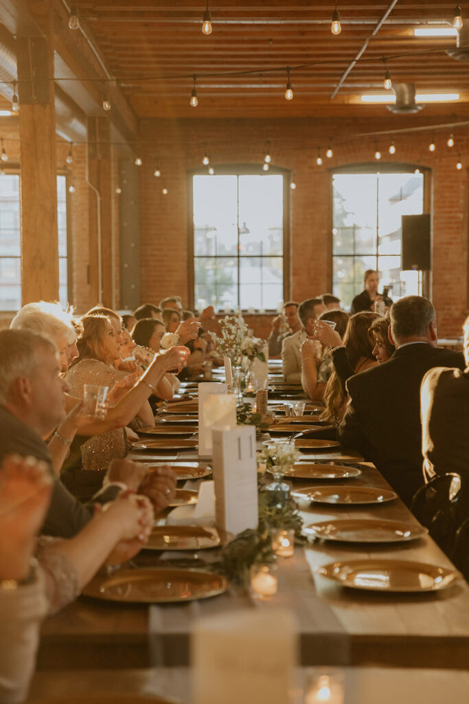 A long dining table filled with people