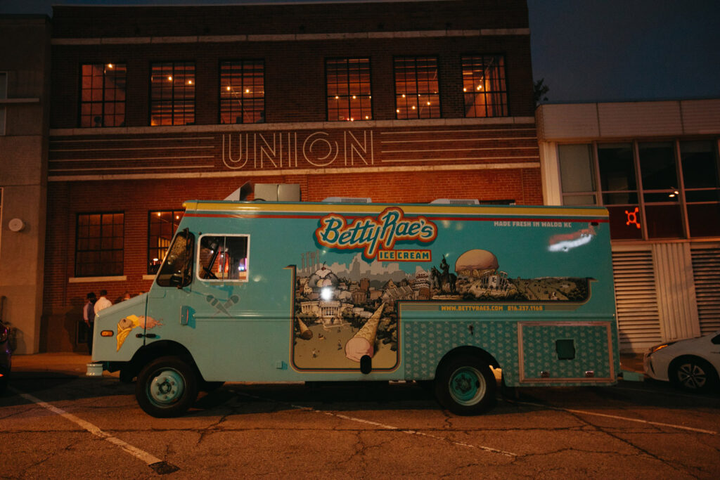 Food truck in front of brick building