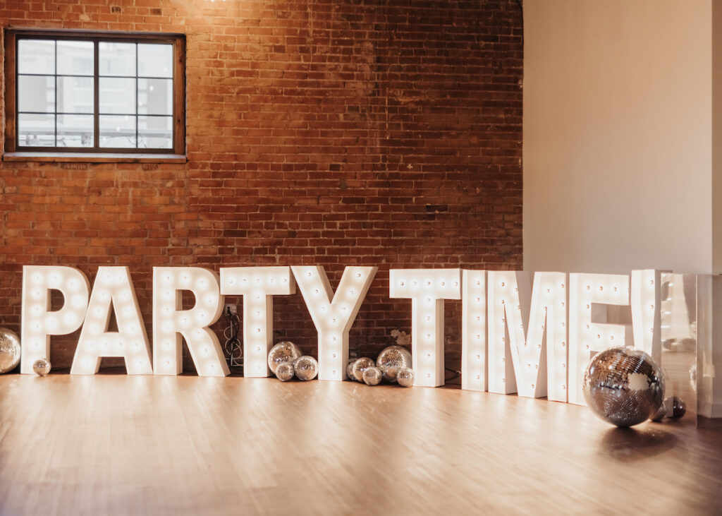 Light up sign that reads Party Time