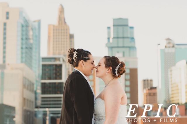 Two brides share a moment at their Kansas City wedding.