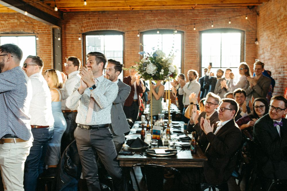 Wedding guests clapping for grooms' grand entrance at UNION