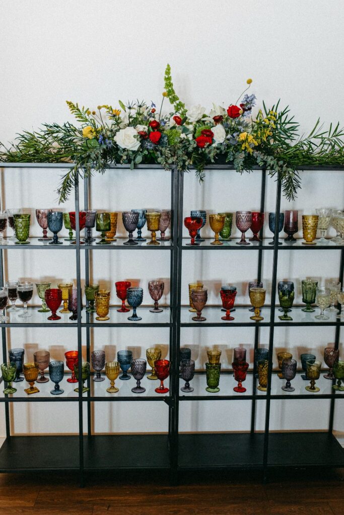 Colorful drinking glasses display in UNION's Speakeasy