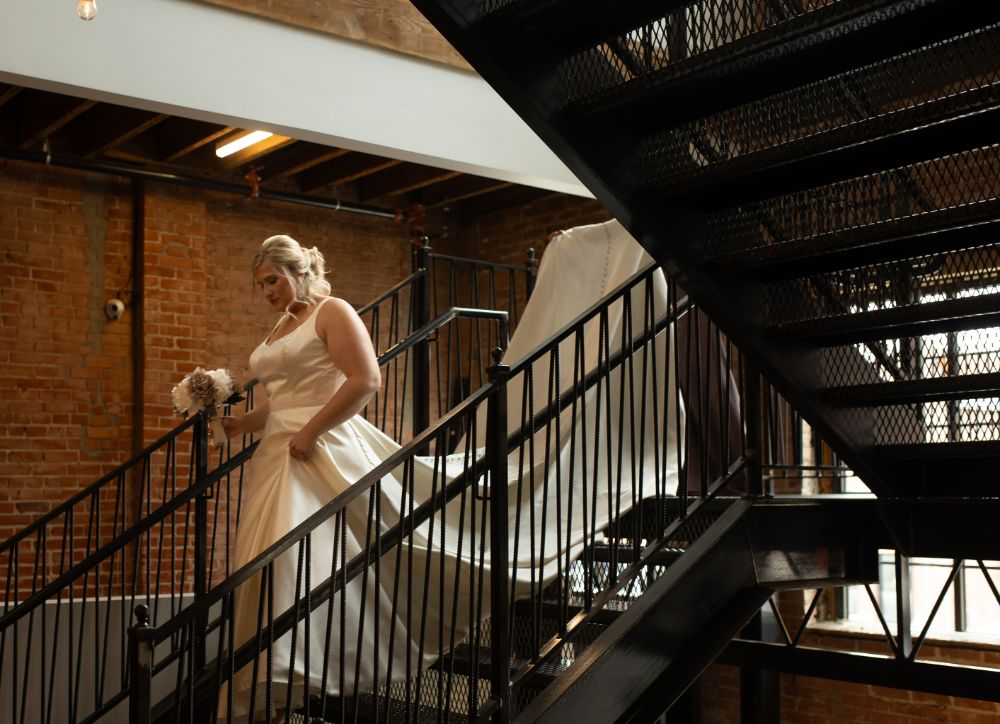 Bride walking down the staircase at UNION