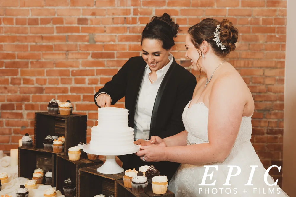 Brides cutting their cake on the wedding day