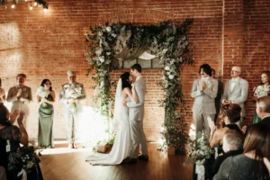 Bride and groom kissing after they say "I do" at UNION