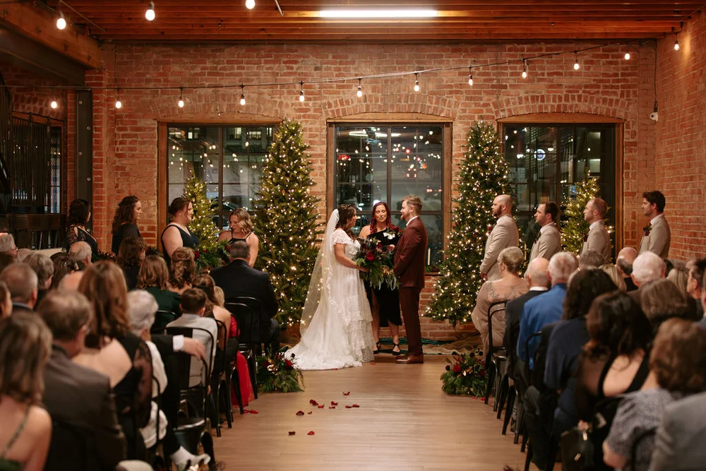 Winter wedding with Christmas Trees as the backdrop at UNION in Kansas City, MO