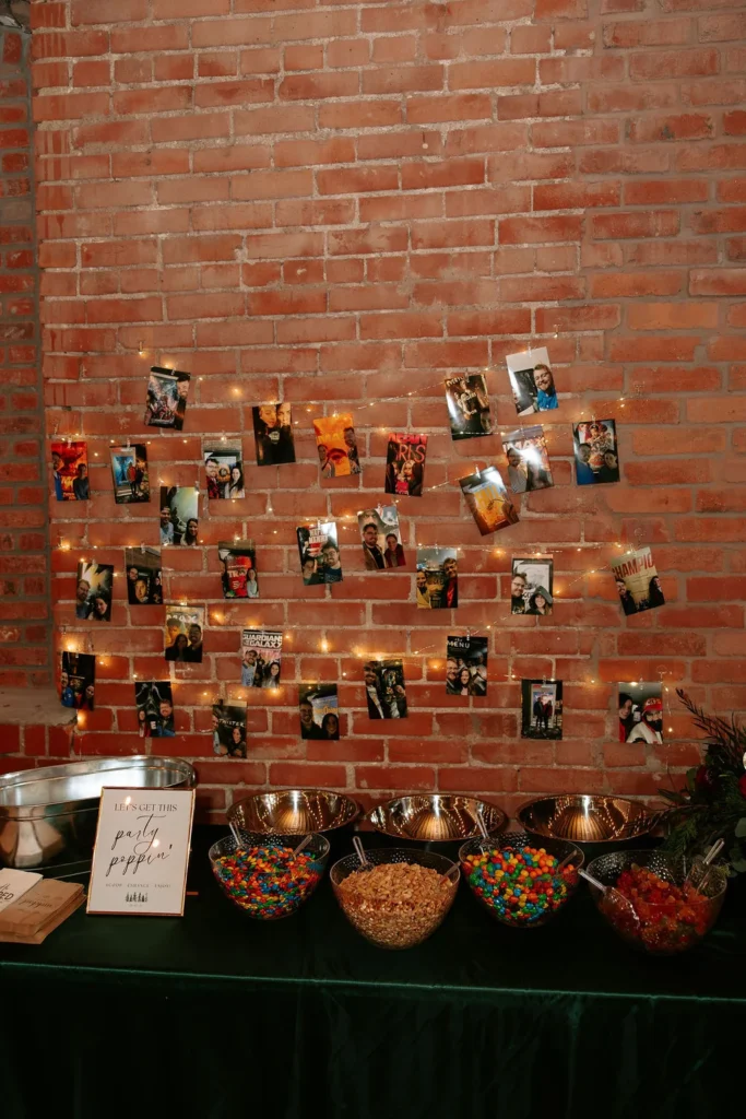 Dessert table with photos of the couple at a wedding in Kansas City, MO