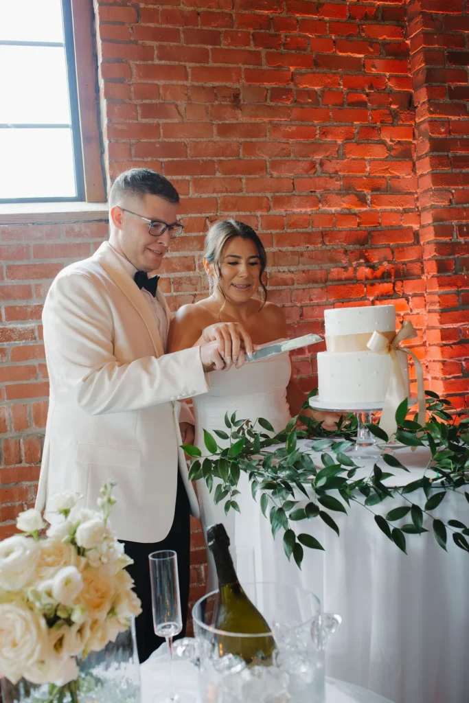 Bride and groom cutting their wedding cake at UNION in Kansas City, MO