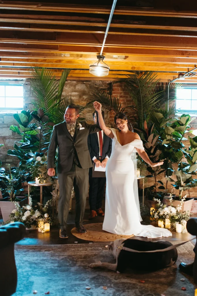 Bride and groom holding hands after their micro wedding ceremony