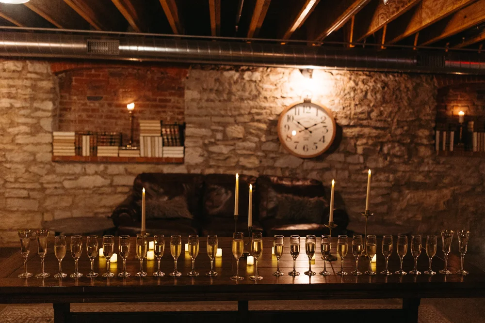 Single row of champagne glasses set up for a celebration in The Goldfinch Room at UNION, Kansas City