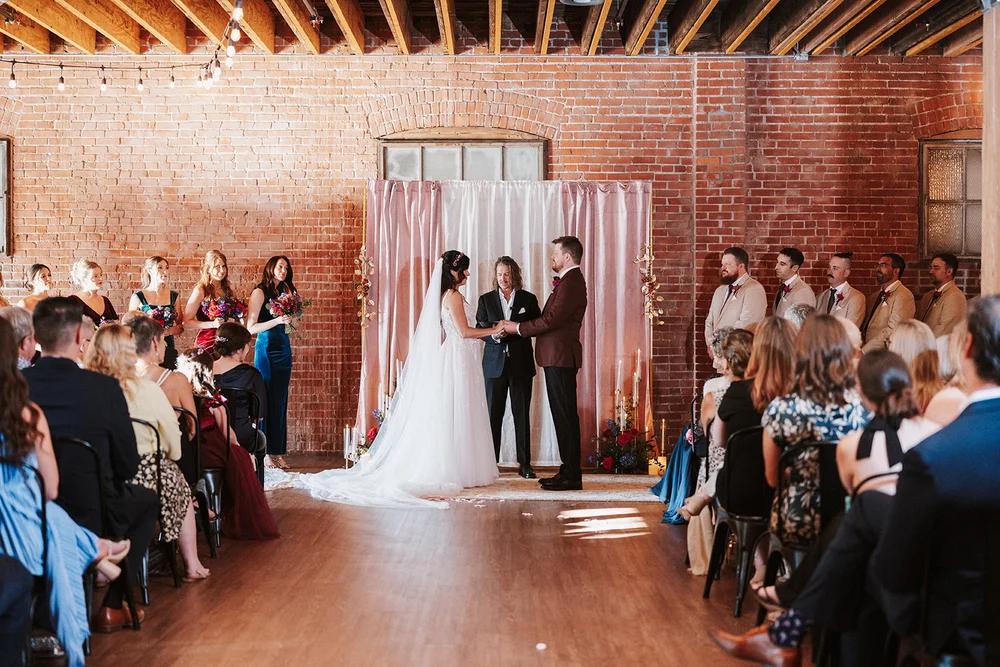 Bride and groom saying their vows at UNION in Kansas City, MO