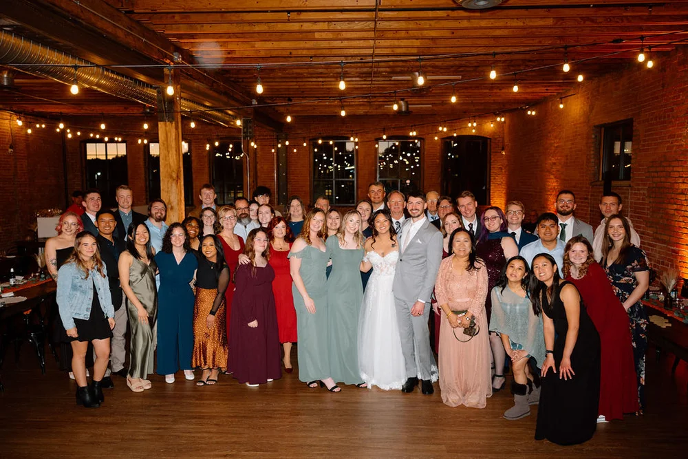 Wedding guests celebrating at UNION Kansas City MO modern rustic wedding reception