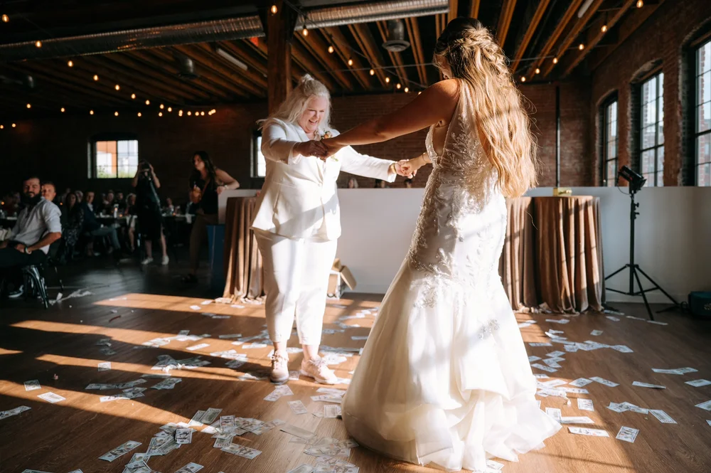 Two brides dancing at their LGBTQ+ wedding reception at UNION in Kansas City MO